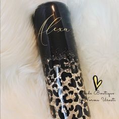 a black and white leopard print tumbler with the name alexa written on it