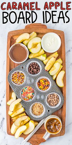 an overhead view of caramel apple board with apples and other toppings on it