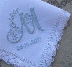 a close up of a piece of cloth with the word j and initials on it