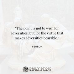 a statue with a quote on it saying the point is not to wish for adversities, but for the virture that makes adverties berable