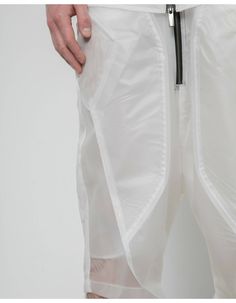 LUNAR LABORATORIES Flight Transparent Short PantsThis product is made from recycled polyester and can be used in all seasons.It will become a statement piece in your everyday wardrobe. This Product can be made from black or white fabric.The creative vision is centered around past work experience in the field of aerospace engineering, emphasizing clear lines, right angles, shapes or layers transposed from the dynamics of flying objects into ready-to-wear pieces with the desire to offer an own per Aerospace Engineering, Work Experience, Everyday Wardrobe, White Fabric, The Field, Short Pants, All Seasons, Statement Pieces, Flight