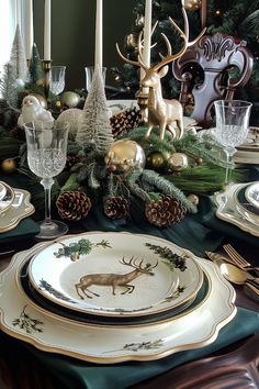 the table is set for christmas dinner with deer and pine cones