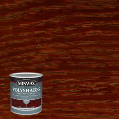 a can of minwax polyshades on a wooden surface with the paint chipped off