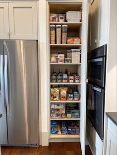 an organized pantry in the corner of a kitchen