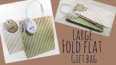 two small bags with tags attached to them and the words large fold flat gift bag