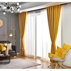 a living room with yellow curtains and furniture