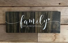 a wooden sign that says family is everything