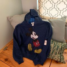 Disney Return. Never Worn. Brand New. Shoulder To Shoulder 19”. Shoulder To Hem 23”. Disney Hoodie With Cartoon Print For Winter, Disney Cartoon Print Hoodie For Winter, Disney Cartoon Print Winter Hoodie, Disney Style Winter Hoodie With Cartoon Print, Mickey Mouse Hoodie Top For Winter, Winter Mickey Mouse Hoodie Top, Mickey Mouse Winter Hoodie Top, Winter Hooded Mickey Mouse Sweatshirt, Blue Long Sleeve Hoodie With Character Print