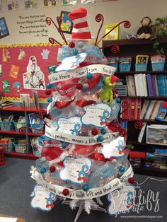 the cat in the hat christmas tree is decorated with red, white and blue ornaments