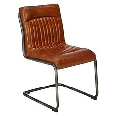 a brown leather chair sitting on top of a metal frame