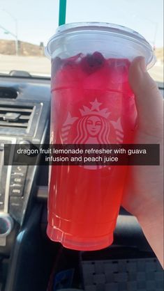 someone is holding up a cup of tea in their hand with the caption dragon fruit lemonade refresher with guava, intision and peach juice