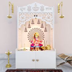 an idol sitting on top of a white cabinet in front of a rug and candles