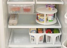 an open refrigerator filled with lots of food and condiments on the bottom shelf