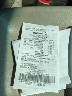 a receipt sitting on the back seat of a car