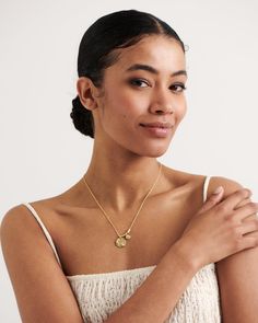 Two unique pendants and gold links dangle from a delicate chain, bringing you a personal love letter from our founder, "Love and Kindness are never wasted". So much more than just a mantra let our Nyon necklace become your talisman & daily reminder to act with care, for others, for the planet & for yourself. Add a touch of classic beauty & pair your Nyon necklace with our Merida earrings. 
Details

Handcrafted in a thick layer of 18k gold on sterling silverAdjustable chain length: 50 cm + 5 cm e Elegant Initial Necklace With Coin Pendant For Gifts, Spiritual Wedding Coin Pendant Necklace, Delicate Engraved Necklace As A Gift For Her, Spiritual Wedding Necklace With Coin Pendant, Delicate Coin Pendant Necklace For Gift, Anniversary Necklace With Coin Pendant, Delicate Coin Pendant Necklace As Gift, Spiritual Engraved Charm Necklace As Gift For Her, Spiritual Engraved Necklace As Gift For Her