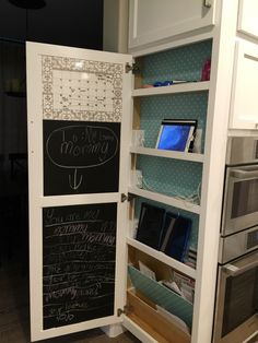 an open refrigerator with writing on the door