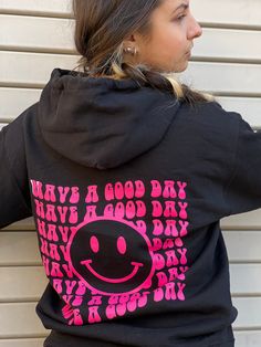 "Print in USA.  \"Have a Good day\". Print in Hot Pink on Black Hoodie and Navy on White Hoodie. Cozy up this season with our latest collection of hoodies  oversized sweatshirt and sweatshirts. Featuring a soft material perfect for chill days, this style is ideal for layering under a trench coat in fall, or wearing alone when the days start to get a little warmer. For days at home, pair a relaxed-fit hoodie  and prepare for comfort heaven.  Style: Printed Hoodie,  Solid color hoodie Back   graphic Fabric: Jersey Length: Regular Neckline: Hooded Sleeve Length: Long Sleeve Ribbed cuffs and hem 60% COTTON 40% POLYESTER. MACHINE WASHABLE. Model measurements: 5'6\", size Small. Wearing size Medium." Cute Black Hoodie With Graphic Print, Fun Black Hoodie For Winter, Fun Hooded Graphic Print Sweatshirt, Fun Winter Hoodie With Letter Print, Winter Fun Hoodie With Letter Print, Trendy Black Hoodie With Screen Print, Fun Letter Print Hoodie For Winter, Black Long Sleeve Fun Hoodie, Fun Hoodie With Letter Print For Streetwear