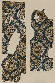 two pieces of cloth with gold and blue designs on them, one is cut in half