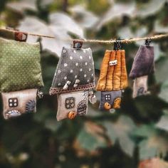 five little houses are hanging on a line