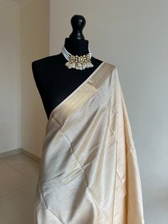 Introducing our exquisite new addition from the  T U S S A R collection: a delicately woven tussar silk saree, luxuriously soft to the touch. Unlike typical tissue, this fabric drapes effortlessly and forms elegant pleats with ease. Its subtle sheen and refined lustre are perfectly complemented by a copper border.  *Available in other colours Cream Colour Saree, Raw Silk Saree, Tussar Silk Saree, Gold Work, Draped Fabric, Cream And Gold, Raw Silk, Silk Saree, Wedding Inspo