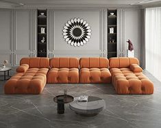 a living room with an orange couch and coffee table