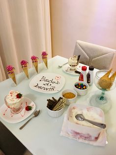 a table topped with lots of cakes and desserts