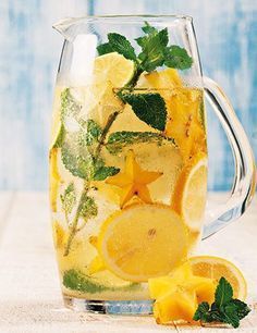 a pitcher filled with lemon and mint water