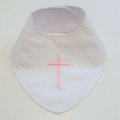 "Waterproof Baptismal and Christening Bib with a light pink cross embroidered on plain white cotton. Perfect to help keep baby's Baptism outfit clean and dry. Simple design. 100% cotton fabric, custom designed, handmade bandana style bib with a soft, yet waterproof PUL (Polyurethane Laminate) backing, which creates a barrier to keep baby's clothes dry. This bib has white double plastic snaps for sizing. Lightweight - Topstitched - Reversible Bib front is Cotton Embroidered Cross Pattern Finished Baby Baptism Outfit, Purple Blanket, Baby Boy Bibs, Waterproof Bibs, Embroidered Cross, Bandana Style, Boy Bib, Baptism Outfit