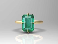 2.30 Carat Natural Emerald Solitaire Ring - 14k solid Gold Emerald Ring - Emerald 4 Prong Set Ring - Gift For Wife - Womens Emerald Ring GEMSTONE DETAILS : ✦ Gemstone : Natural Emerald ✦ Gemstone Size : 8 x 11 mm ✦ Gemstone Shape : Emerald Cut ✦ Number of Gemstones : 1 ✦ Gemstone Weight : 1.20 Carat ✦ Gemstone Grade : Vivid METAL DETAILS : ✦ Metal : 14K/18K /22K Gold ✦ Metal Color : Yellow / White / Rose Gold ✦ Setting : Prong Setting ✦ Box : Yes SHIPPING DETAILS : ✦ Production time : 3-4 days ✦ Delivery time : 7-8 days ✦ Expedited shipping : Available ✦ Expedited shipping service : UPS ✦ Expedited shipping time : 5 days ✦ Expedited shipping cost : 70$ CUSTOMISATION DETAILS : We can customize any piece of fine jewelry. You can simply message us on Etsy or drop a text at +91-9256366933 (Wha Emerald Solitaire Ring, Gold Emerald Ring, Smaragd Ring, Emerald Ring Gold, Rainbow Sapphires, Ring Emerald, Set Ring, Emerald Gemstone, Gift For Wife