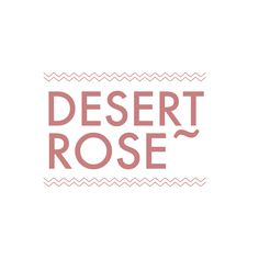 the words desert rose written in pink on a white background