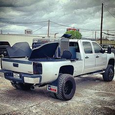 a white truck parked in a parking lot