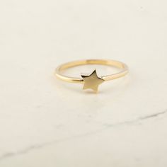 14K Solid Gold Star Ring - 14k Gold Small Astral Star Ring - 14k Gold Celestial Ring - 14k Gold Lucky Star Ring  14k Gold Star Stacking Ring ★★ Description ★★ Illuminate your style with our 14K Solid Gold Star Ring. Available in Gold, Rose Gold, and White Gold, this exquisite piece features a beautifully detailed star design measuring 6.4mm in both height and width. The delicate yet captivating star adds a touch of celestial elegance to your jewelry collection. Whether you wear it as a symbol of Minimalist Gold Star Shaped Rings, Minimalist Gold Star Rings, 14k Gold Star-shaped Celestial Rings, 14k Gold Celestial Star Ring, Celestial Star-shaped 14k Gold Rings, Celestial Star-shaped Yellow Gold Rings, Star-shaped 14k Gold Stamped Ring, 14k Yellow Gold Star-shaped Rings, 14k Yellow Gold Star Shaped Rings