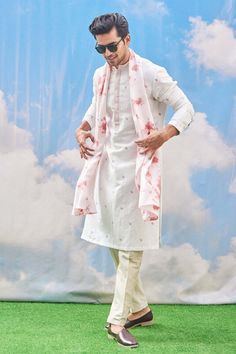 Off white kurta with hand embroidered leaf motifs. Paired with tie-dye coral pink, white stole and beige silk pant. 
Component: 3
Pattern: Embroidered
Type Of Work: Leaf
Neckline: Mandarin
Sleeve Type: Long Sleeves
Fabric: Kurta - Cotton  Blend, Stole and Pant-Silk Viscose Blend
Color: Beige
Other Details: 
Leaf motifs
Occasion: Puja - Aza Fashions Beige Kurta, White Stole, Embroidered Leaf, Kurta Cotton, Embroidered Leaves, White Kurta, Beige Silk, Ethnic Design, Man Set