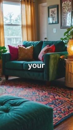 a living room with green couches and rugs on the floor next to windows