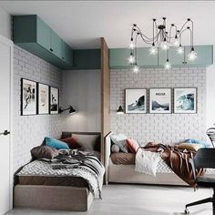 a bedroom with two beds, a desk and some pictures on the wall above them