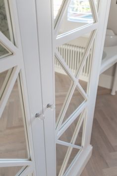 the interior of a house with white walls and wood floors