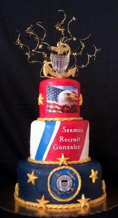 a three tiered cake with an eagle and flag design on the top, surrounded by stars and confetti