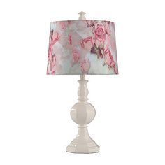 a white table lamp with pink roses on it