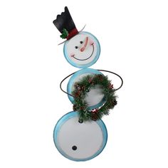 a snowman with a wreath on top of it