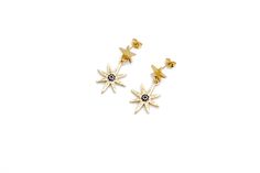 These blue star earrings are so unique and lovely! They feature 18k gold plated brass multipoint star charms with blue and clear cubic zirconia rhinestones. Each earring is finished with a stainless steel star ear post. MATERIALS 18k Gold Plated Charm Stainless Steel Ear Posts LENGTH 1 1/4" CARE Direct contact with perfumes and moisture should be avoided to minimize damage or discoloration. Please remove before showering, swimming or exercising. It is not recommended to wear earrings while sleep Gold Star Charm Earrings In 14k Gold, Gold Plated Star-shaped Pierced Earrings, Luxury Celestial Earrings With Star Charm, Blue Star Earrings With Star Charm, Blue Star Charm Drop Earrings, Luxury Celestial Star Charm Earrings, Blue Star Earrings, Star-shaped Cubic Zirconia Earrings With Star Charm, Blue Star