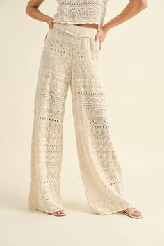 These crochet pants offer a comfortable and relaxed fit that are perfect for any occasion. Made with high-quality stitching and attention to detail, these pants are sure to be a staple in any wardrobe. Complete the look with the matching top, sold separately. Fit & Details: True to size ; Relaxed Fit Model Details: Model is wearing a size S Cheap Summer Bottoms With Lace Trim, Cheap Stretch Bottoms With Lace Trim, Cheap Feminine Bottoms With Lace Trim, Luxury Wide Leg Pants With Lace Trim, Luxury Fitted Bottoms For Vacation, Luxury Sheer Summer Pants, Luxury Lace Women's Bottoms, Luxury Lace Trim Fitted Sets, Luxury Fitted Lace Trim Sets