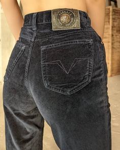 "Vintage navy blue velvet pants from Versace jeans Couture. High-waisted jeans with zipper and button closure at front. Two pockets at front and two on the back. Ankle length. Silver buttons and hardware with medusa head. The length of the jeans is hemmed. Condition 9/10 (small stain on the back of the leg) Size 27/41 Made in Italy 100% cotton Length- 37-38\"/95+3 cm In-Seam- 27\"/68.5 cm Waist- 12\"/30 cm Hips- 16\"/41 cm All measurements taken with garment lying flat. Vintage sizes vary greatl Velvet Jeans Outfit, Blue Velvet Pants, Navy Blue Trousers, 90s Versace, Aw 23, Versace Jacket, Vintage Red Dress, Velvet Jeans, Velvet Cocktail Dress