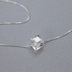 Swarovski crystal cube bead on fine sterling silver box necklace chain. PLEASE SEE THIRD PHOTO FOR NECKLACE SIZING GUIDE Cube pendant measures 8mm x 8mm Also available in smaller cube (6mm x 6mm) https://www.etsy.com/listing/187758077/swarovski-cube-necklace-sterling-silver?ref=listing-17 COMES CAREFULLY AND BEAUTIFULLY GIFT PACKAGED.  MORE FROM ALEXANDREASJEWELS: https://www.etsy.com/shop/alexandreasjewels SEE FAQ's below for shipping policy details Silver Necklace Layering, Xoxo Necklace, Necklaces Layered, Birthday Necklace Gift, Cube Necklace, Pretty Jewelry Necklaces, Casual Necklaces, Layered Necklaces Silver, Necklace Layering