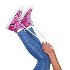 These retro-inspired pink 80s sneakers are a blast from the past! With a bold and bright color, these shoes are sure to bring back the nostalgia of the 80s. Whether you're going out on the town, or just want to add a fun splash of color to your wardrobe, these shoes are perfect! Get your pair today and make a statement! D E T A I L S * 100% polyester canvas upper side * Ethylene-vinyl acetate (EVA) rubber outsole * Faux leather toe cap * Removable insole * White laces * Padded collar, lace-up front S I Z E S  * 5-12 (includes half sizes)  T U R N A R O U N D * T I M E   * Made as ordered and typically ship within 5-9 business days, Monday through Friday. C O M P U T E R * M O N I T O R S * Please note that all computer monitors display colors differently and the item you receive may differ Retro High-top Custom Sneakers, Trendy Pink High-top Custom Sneakers, Retro Pink Low-top Skate Shoes, Retro Pink Lace-up Sneakers, Funky High-top Sneakers For Spring, Retro Pink Lace-up High-top Sneakers, Retro Pink High-top Sneakers With Round Toe, Pink Mid-top Skate Shoes For Spring, Spring Pink Mid-top Skate Shoes