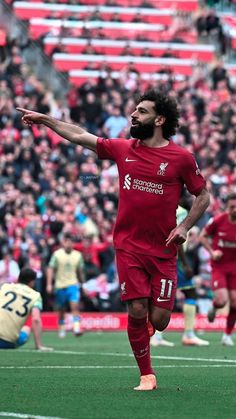 a man with a beard is playing soccer