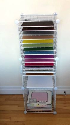 a rack with many different colored papers on it