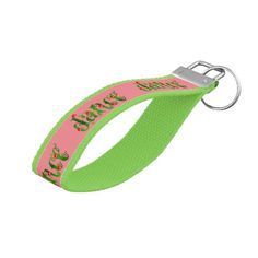 a pink and green lanyard with an apple on the side, in front of a white background