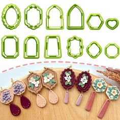 the cookie cutters are decorated with flowers and leaves, along with other items for making cookies