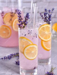 two glasses filled with lemonade and lavender