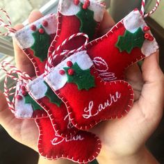 handmade christmas stockings ornament with name and candy canes hanging from strings